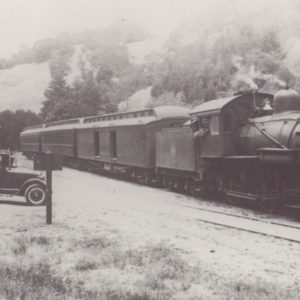 Cool old Car Parked in Front of the #222 Steamer at the Cazadero Train Station