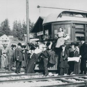 Lady Standing on a Electric Trolley Car at the Forestville Train Station