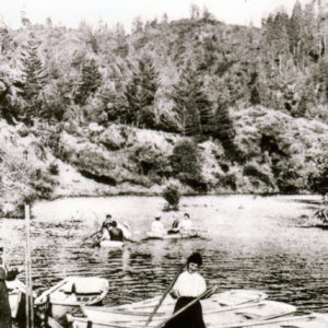 Lady Standing on a Canoe Holding Her Oars at Hilton Head Beach Camp Vacation in Forestville