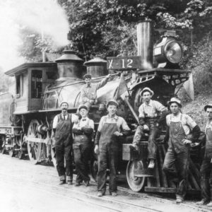 Engineer, Conductor and Train Crew Posing in Front of the X-12 Steam Locomotive