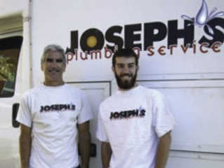 Joseph's Plumbing Guys Standing in Front of Van